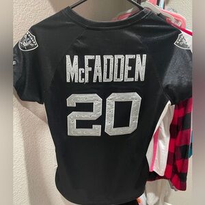 Woman’s size S/M raiders jersey
